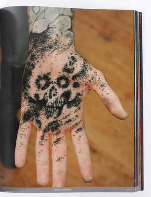 Black-Tattoo-Book-2-hand.jpg