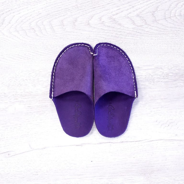 A pair of purple leather slippers for kids