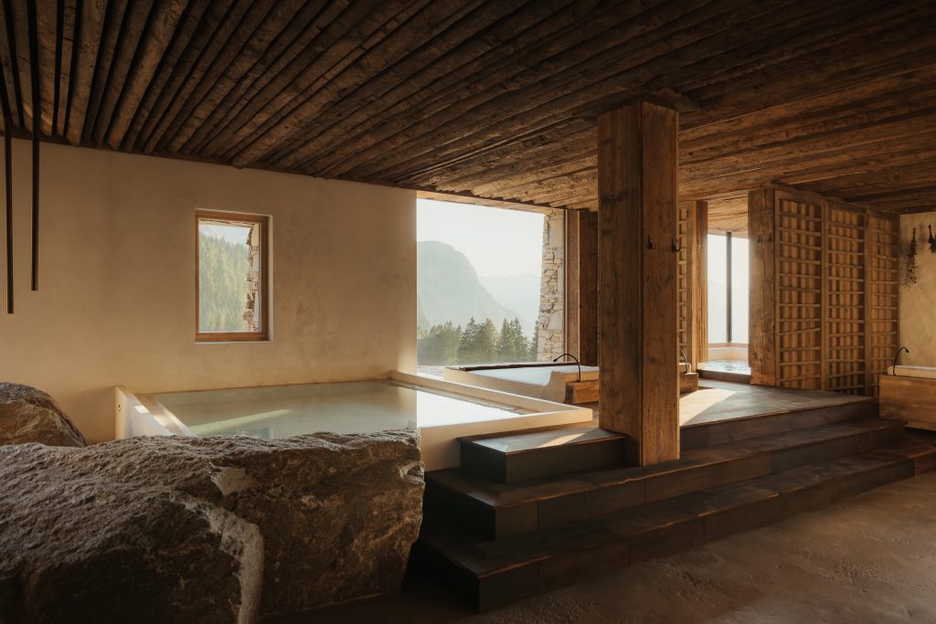 spa with large soaking tub and lounge bed facing windows