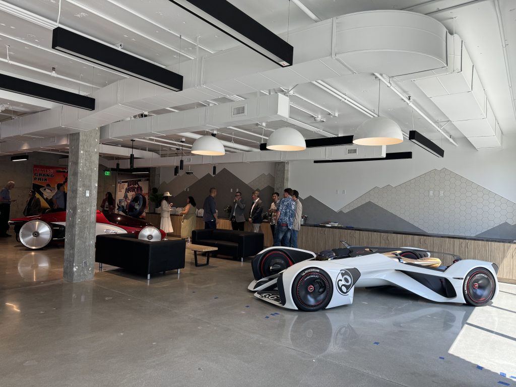 concept cars in a lobby on a polished concrete floor