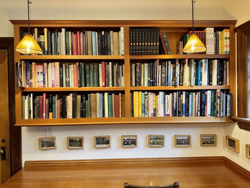 book shelves above a desk