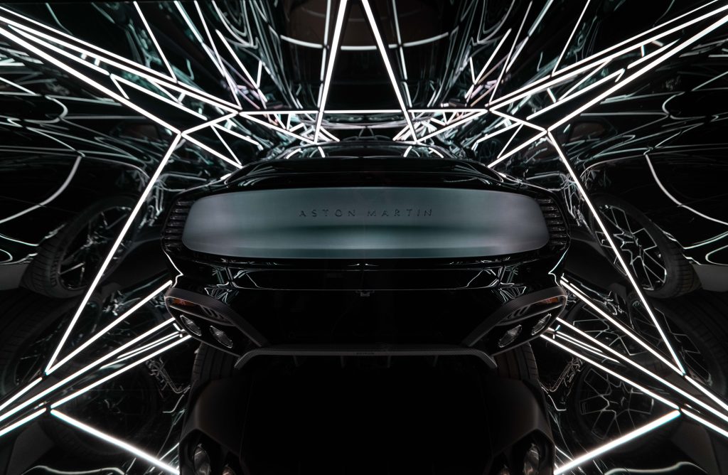 Artist Anthony James wrapped an Aston Martin Vanquish car in glass and metal box with lighting; rear view