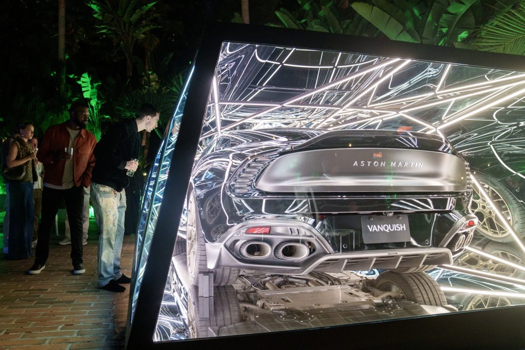 Artist Anthony James wrapped an Aston Martin Vanquish car in glass and metal box with lighting