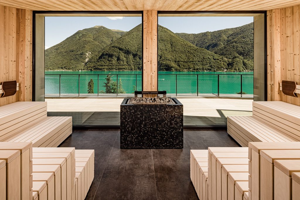 Very large windows provide a view of lake Lugano from the modern steam room